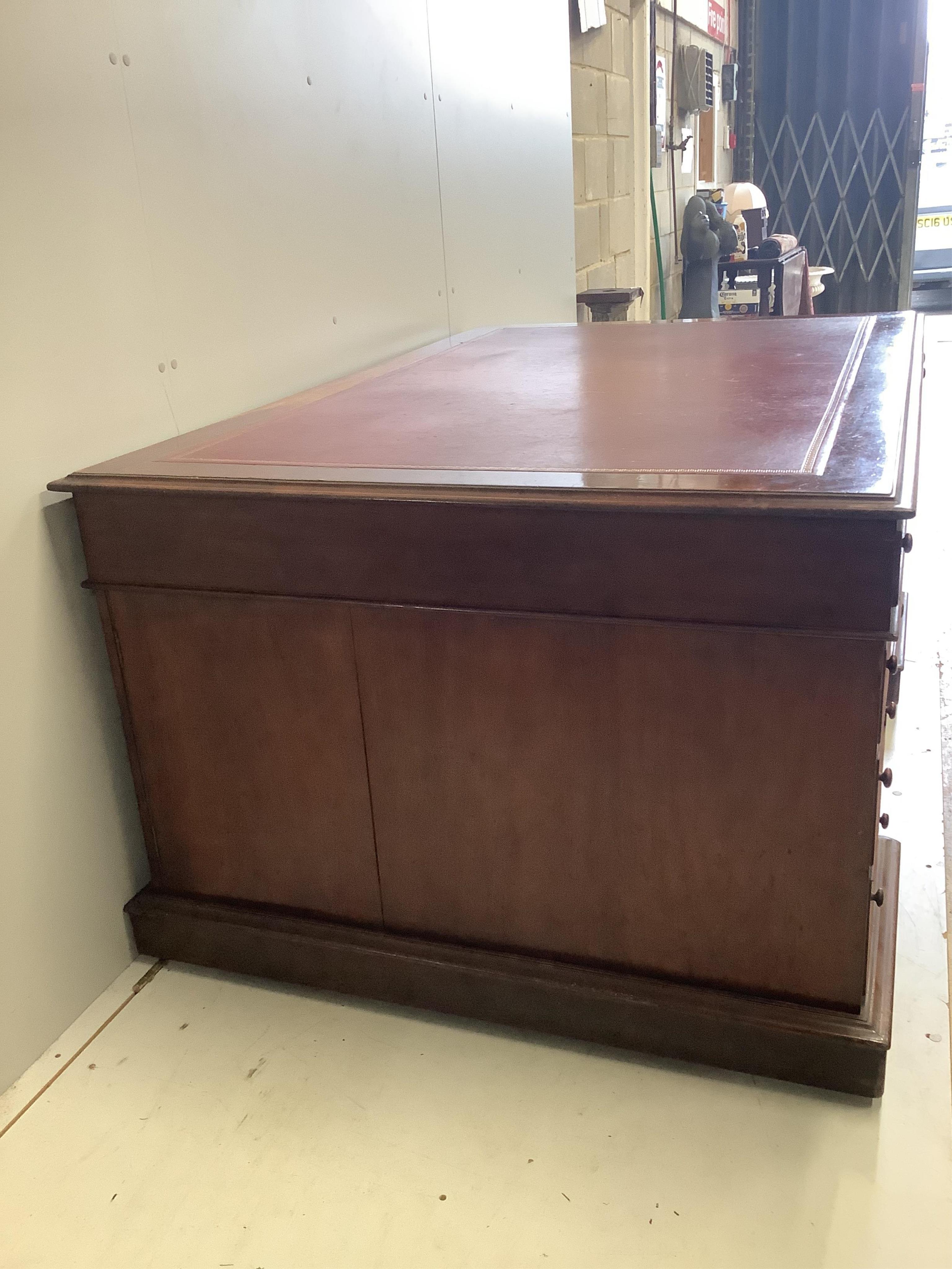 A Victorian mahogany pedestal partner's desk, width 168cm, depth 110cm, height 80cm. Condition - fair